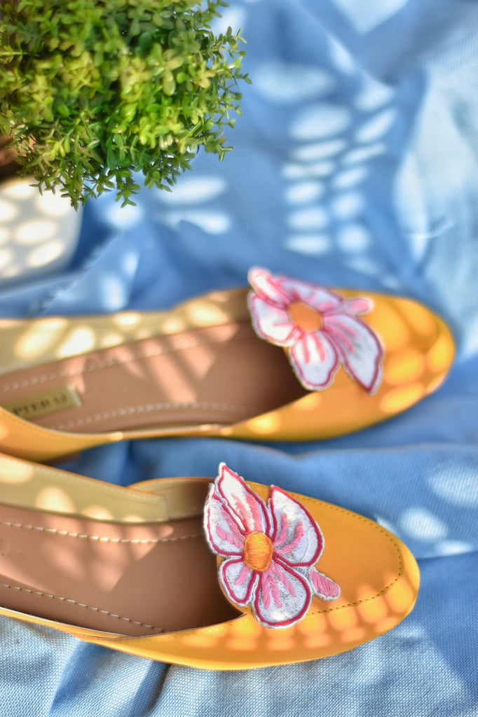 Yellow color khussa style loafer with a applique flower on top