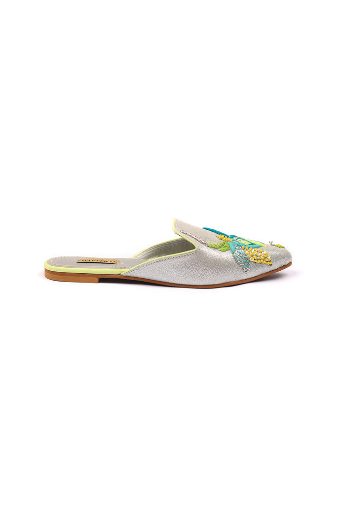 Neon thread colored embroidered motif on pointed glittery mule 